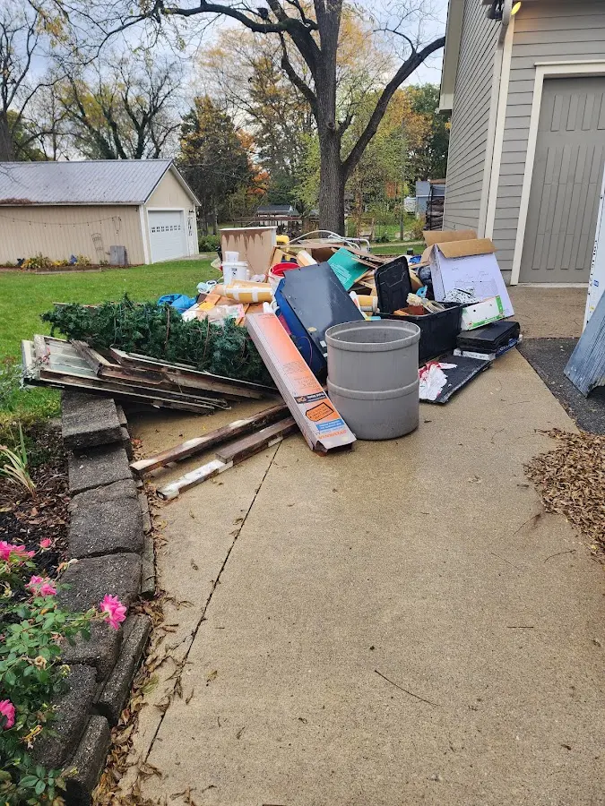 Dumpster being loaded with debris for Residential Dumpster Rental in Firestone